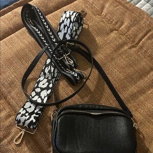 Elegant Black Crossbody Bag with Patterned Strap